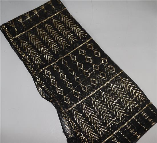 A gold and black 1030s Egyptian metallic stole